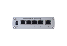 Seitlich Ansicht des Switches. Von links nach rechts sin der Anschluss für das Netzteil und 5 LAN Anschlüsse zu sehen.